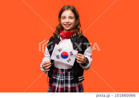 Girl holds small Republic Korea flag 101660066