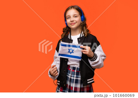 Girl holds small flag Israel Girl holds small flag Israel 101660069