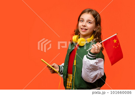 Girl holds small flag China Girl holds small flag China 101660086