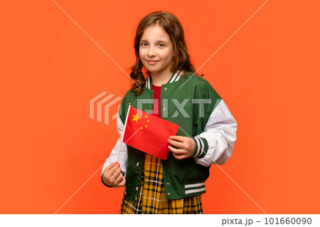 Girl holds small flag China 101660090