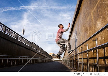 Man doing parkour. Extreme sports Man doing parkour. Extreme sports 101661065