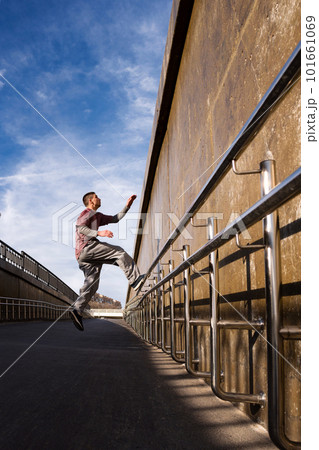 Man doing parkour. Free runner Man doing parkour. Free runner 101661069