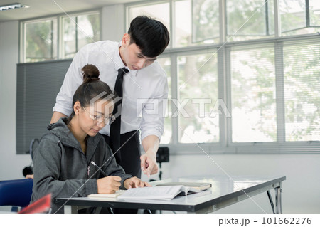 University students study hard and listen to teachers for their lessons with special lectures in the columns of math class University students study hard and listen to teachers for their lessons with special lectures in the columns of math class 101662276