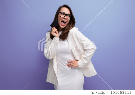 portrait of successful young business woman proudly standing with money card with salary portrait of successful young business woman proudly standing with money card with salary 101665213