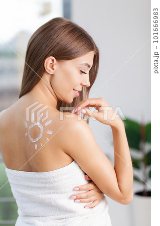 Skin care, woman use skin care products at home in light bathroom Skin care, woman use skin care products at home in light bathroom 101666983