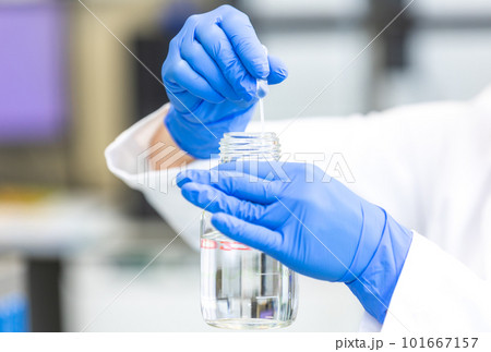 Young woman scientist holding test tube with lab glassware, science laboratory research and development concept, laboratory research Young woman scientist holding test tube with lab glassware, science laboratory research and development concept, laboratory research 101667157