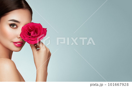 Beautiful young woman a rose flower 101667928