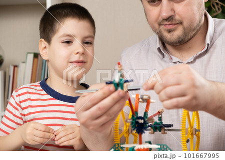 Dad and son build figures from the constructor. Spending time together, the role of the father in the child's life 101667995