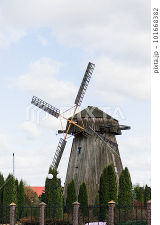 Old wooden wind mill in on a sunny day. Old traditional Dutch mill. Old wooden wind mill in on a sunny day. Old traditional Dutch mill. 101668382