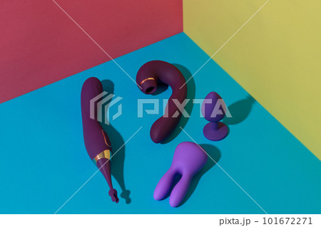 Top view of buttplug and dildos vibrator for sex on colored background. Sex shop concept 101672271