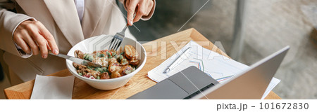 Close up of businesswoman is having a business lunch during working day in cafe. Blurred background 101672830
