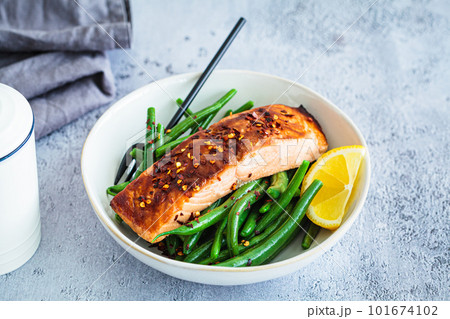 Spicy teriyaki salmon with green beans. 101674102