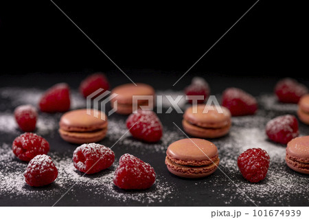 macaroons of different colors on a black background macaroons of different colors on a black background 101674939