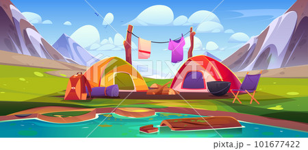 Mountain camp with tents and campfire near lake 101677422