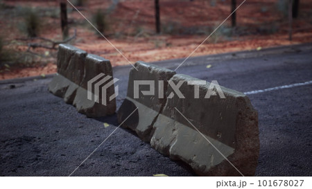 old rusted concrete road barrier blocks 101678027