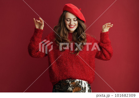 happy stylish female in red sweater and beret...の写真素材 [101682309] - PIXTA