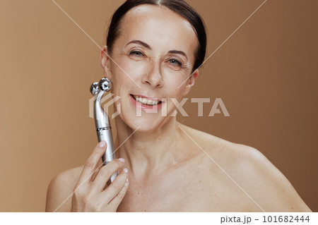happy modern female against beige background happy modern female against beige background 101682444