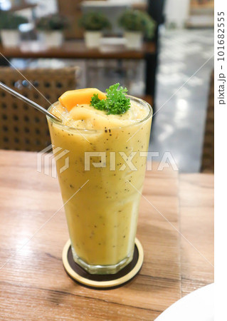 mango smoothie or mango yogurt smoothie, mango and passion fruit smoothie with mango topping 101682555