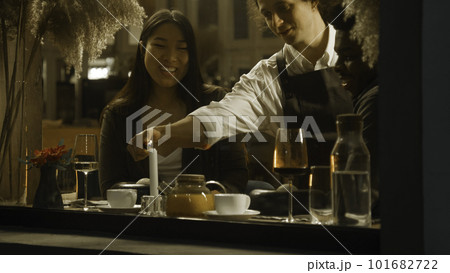 Multi ethnic couple in modern gastro cafe 101682722