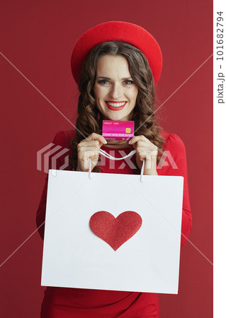 happy elegant woman in dress and beret isolated on background happy elegant woman in dress and beret isolated on background 101682794