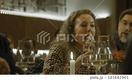 Woman celebrates birthday with friends in cafe Woman celebrates birthday with friends in cafe 101682901