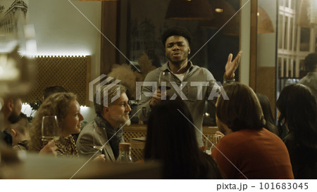 African American man says toast on birthday party in cafe 101683045