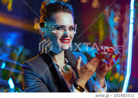 Portrait of happy modern female in metaverse 101683511