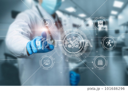 Doctor works on a virtual screen with the study of molecules. 101686296