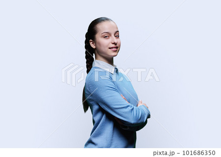 Portrait of smiling high school student girl on white background 101686350