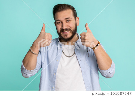 Lebanese man raises thumbs up agrees or gives positive reply recommends advertisement likes good 101687547