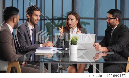 discussing online project, showing computer presentation to skilled team leade discussing online project, showing computer presentation to skilled team leade 101690175