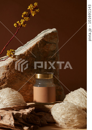 Close-up angle of transparent jar containing bird nest soup with empty label, some edible bird nests putted around. Bird nest is known as beauty food for women to have perfect skin Close-up angle of transparent jar containing bird nest soup with empty label, some edible bird nests putted around. Bird nest is known as beauty food for women to have perfect skin 101691143