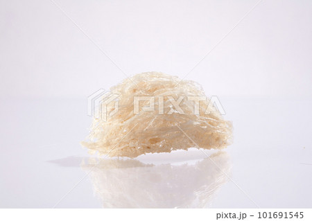 Close up of raw bird nests isolated on white background. Food of natural origin, expensive culinary ingredient for health - Anti-aging, brighten skin, prevent melasma, freckles effectively 101691545