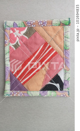 Colorful handmade textiles. Colored fabric patchwork background. Patchwork background. Multicolored patchwork knitted background. 101694835