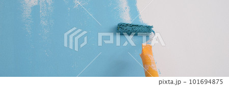 Professional decorator painting wall in blue color. Professional decorator painting wall in blue color. 101694875