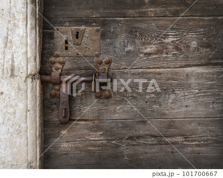 metal antique bolt on the old wooden door 101700667