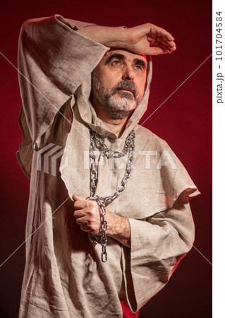 A wandering monk with a chain around his neck seeking the eternal verities A wandering monk with a chain around his neck seeking the eternal verities 101704584