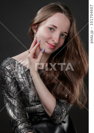 Portrait of girl with long hair and with long color fingernails 101704607