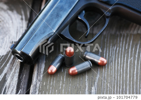 Bullets Near Handgun Bullets Near Handgun 101704779
