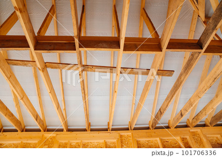wooden beams inside the house under construction. roof construction. 101706336