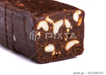 Raw pressed date with nuts and fruit bars isolated on white background. Healthy gluten free snack for energy and diet 101706555
