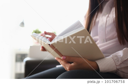 Closeup of female author writing notes in journal at home Closeup of female author writing notes in journal at home 101706758