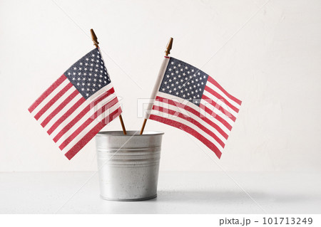 American flags in metal decorative bucket. USA Independence Day. American flags in metal decorative bucket. USA Independence Day. 101713249
