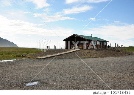 View of a house in a field on a beautiful day in Iceland 101713455