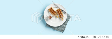 Oatmeal Belgian waffles in pencil shape on blue table. Flat lay top view Oatmeal Belgian waffles in pencil shape on blue table. Flat lay top view 101716340