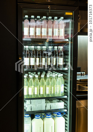 Coffee shop interior with a variety of bottled non-alcoholic beverages Coffee shop interior with a variety of bottled non-alcoholic beverages 101716373