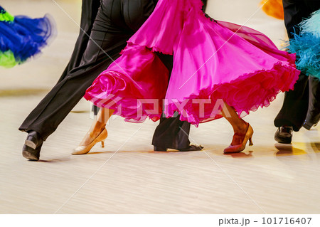 close-up part pink ball gown and and man black tail suit on dance floor 101716407