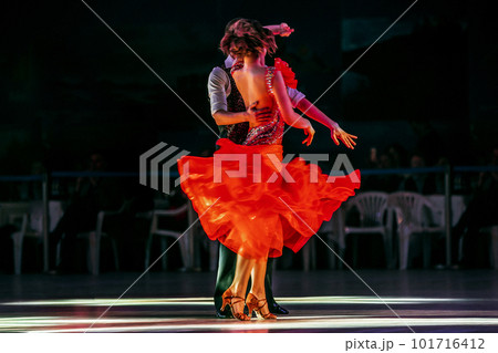 couple dancing in competitive ballroom dancesport, demonstration performance of best dancers 101716412