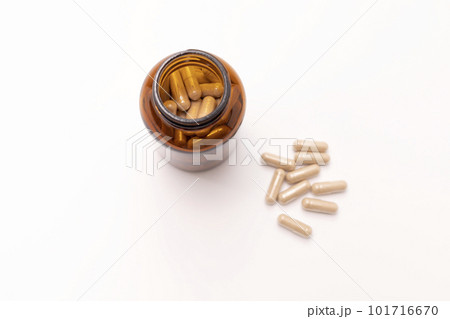 Beige Powder Pills, Capsules OF Slippery Elm, Brown Dark Bottle On White Background. Herbal Supplement, Medication. Ulmus Fulva, Natural Remedy Concept. Horizontal, Top View 101716670