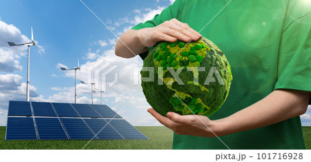 Woman holding a green planet Earth 101716928